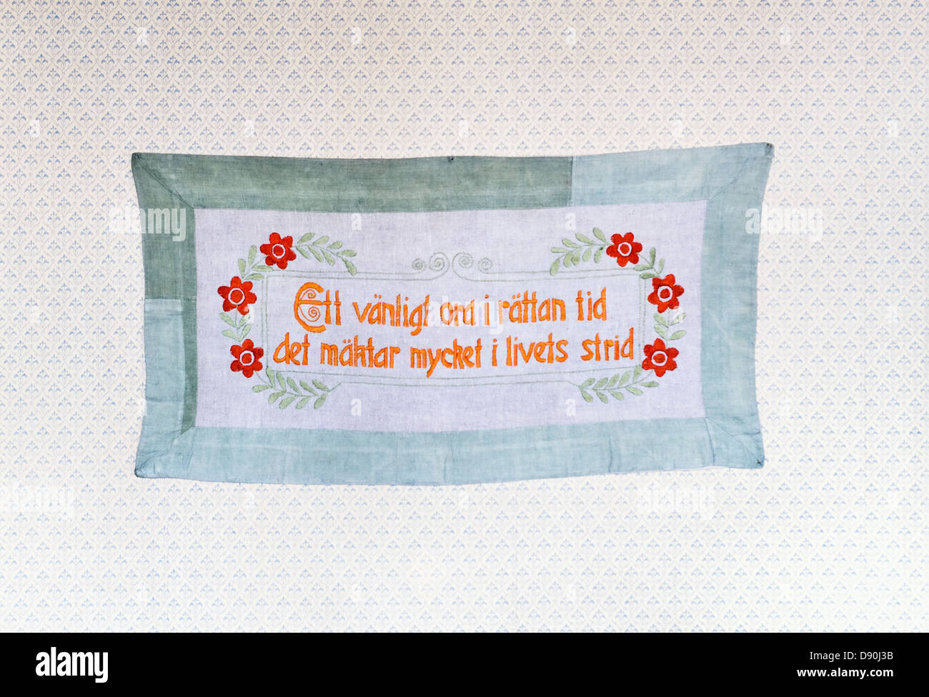 Embroidered message on a wall hanging, Sweden Stock Photo - Alamy