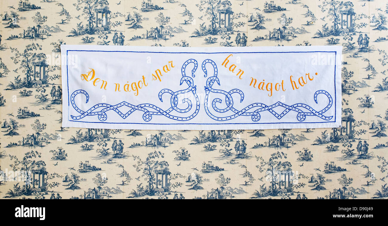 Embroidered message on a wall hanging, Sweden Stock Photo - Alamy