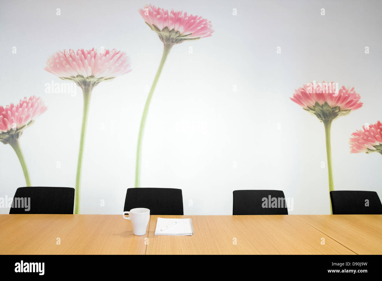 Flowers on the wall in en empty conferens room. Stock Photo
