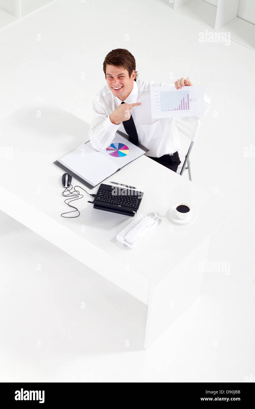 overhead view of businessman pointing at data chart Stock Photo Alamy
