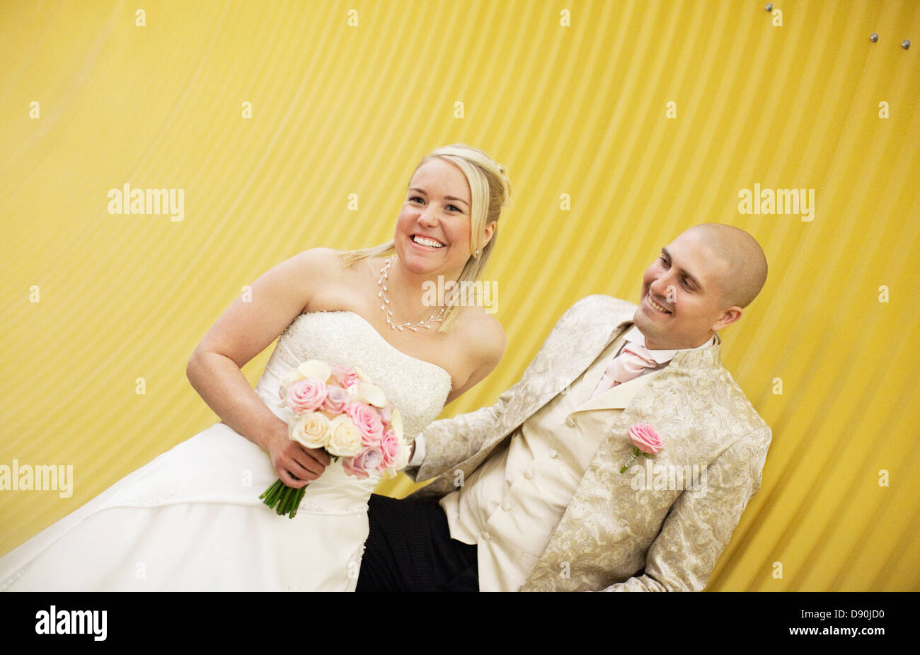 Portrait of bride and groom laughing Stock Photo