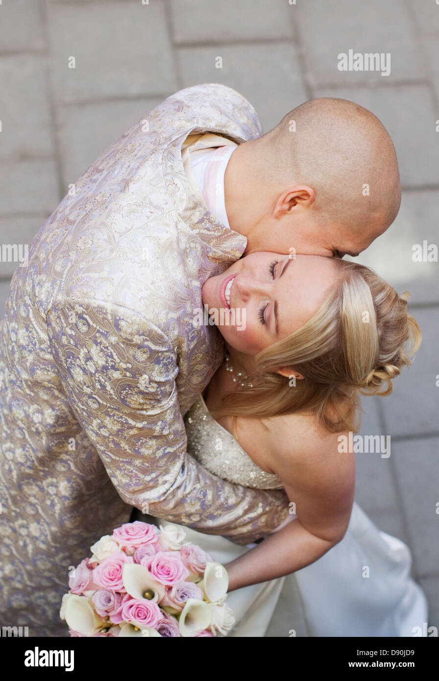 High-angle view of groom kissing bride Stock Photo