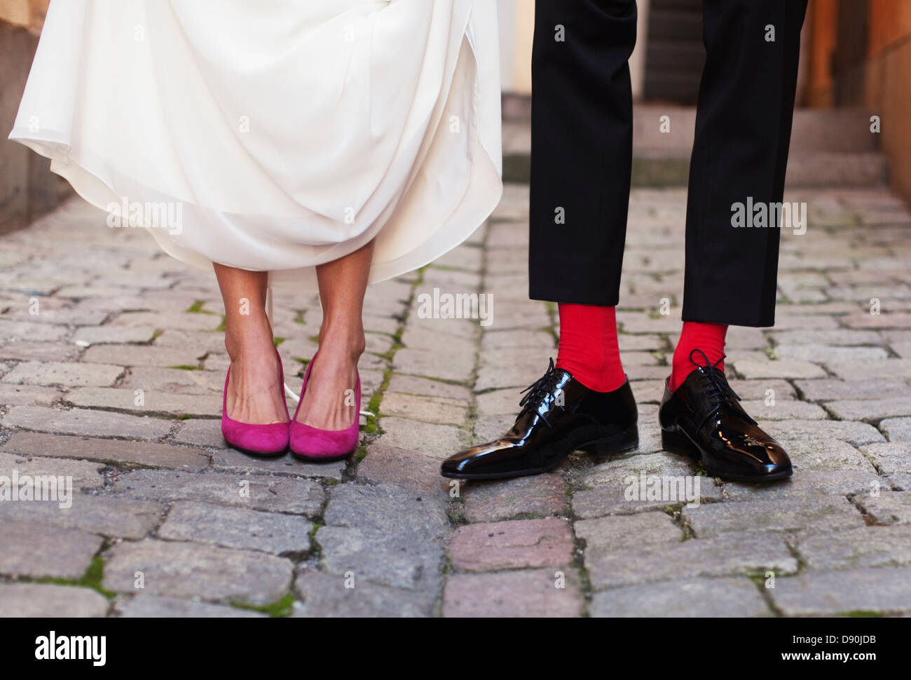 Low section of bride and groom standing side by side Stock Photo