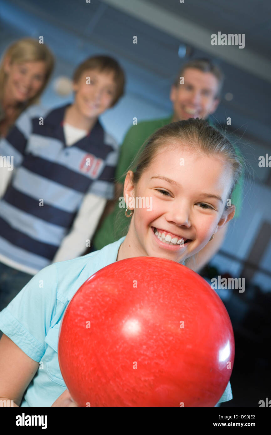 A girl holding a bowling ball Stock Photo Alamy