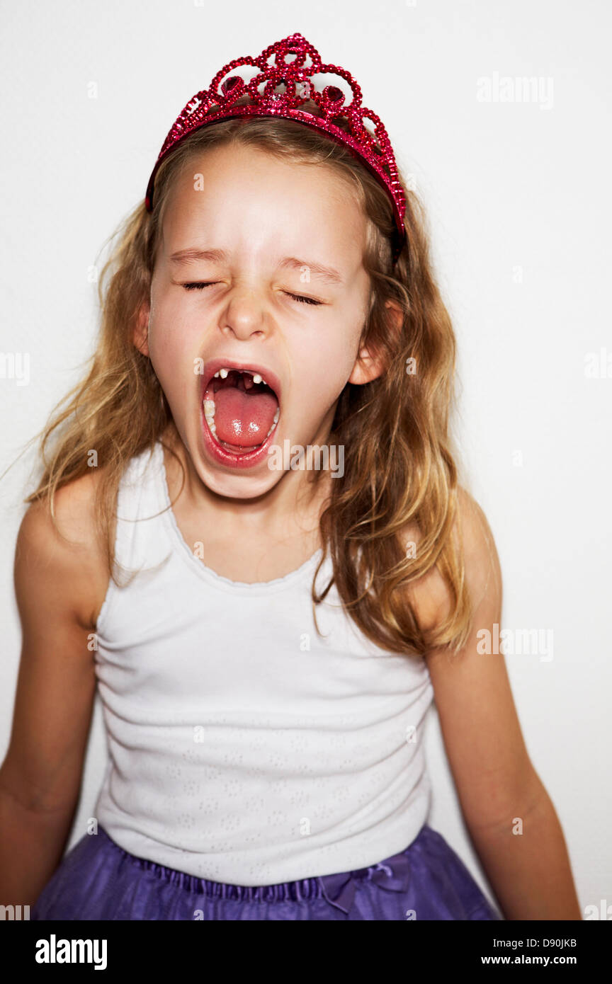 Angry girl in fancy dress costume screaming Stock Photo