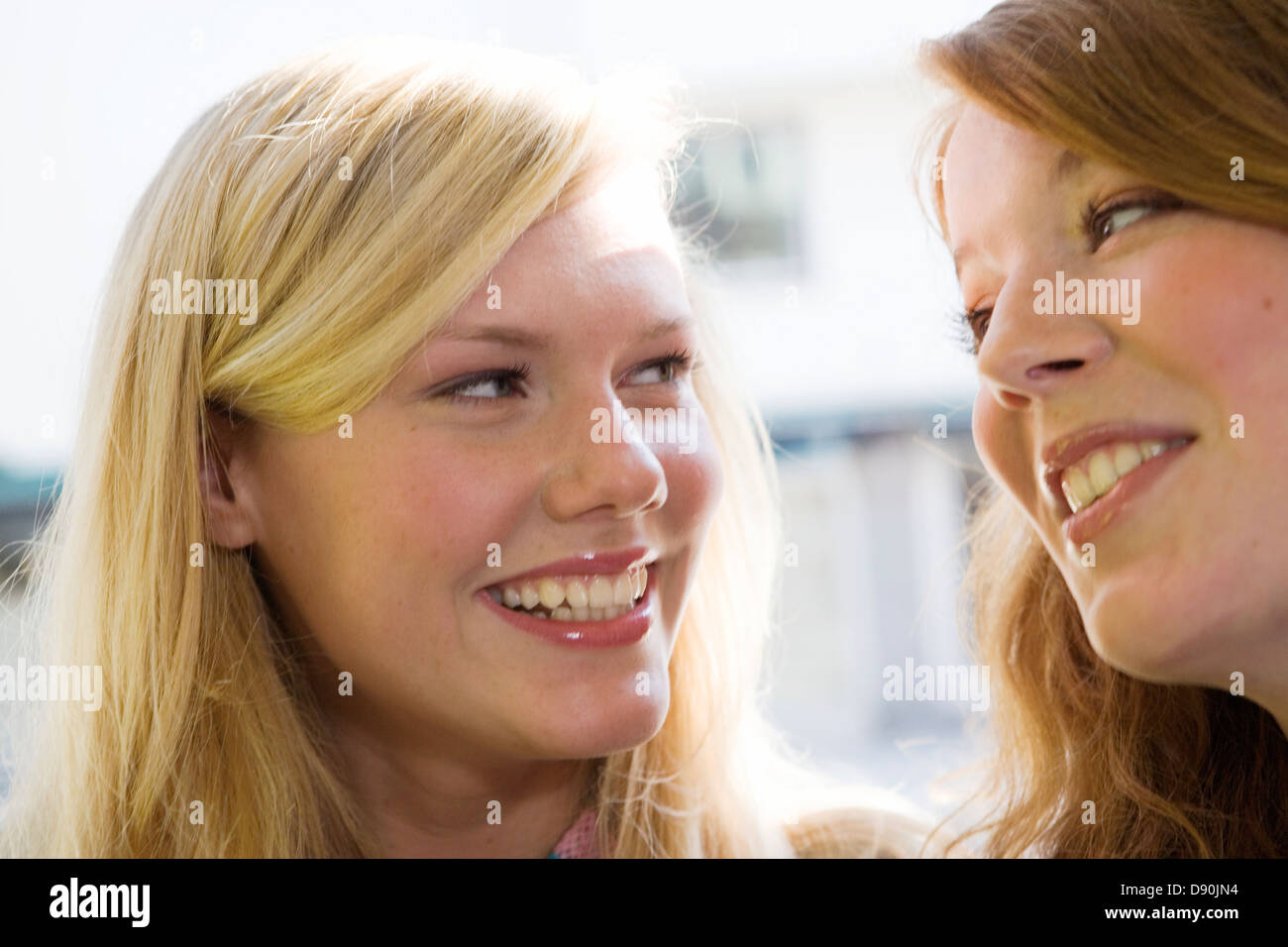 Two smiling teenage girls Stock Photo - Alamy