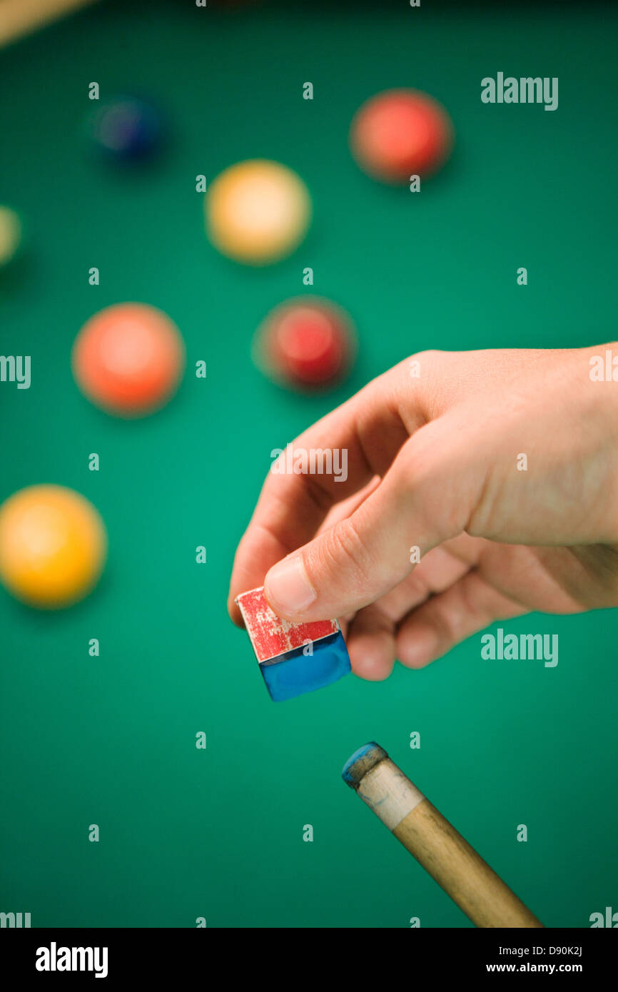 Male pool player chalking cue, closeup Stock Photo Alamy