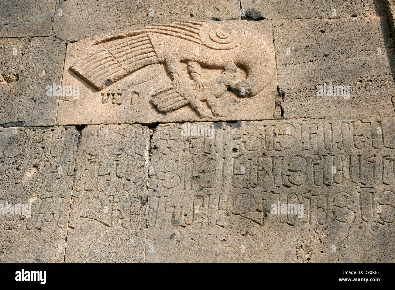 Stone relief of the bird and carved inscription on the wall of Surp Stepanos Church of Tanahat Monastery, Armenia Stock Photo