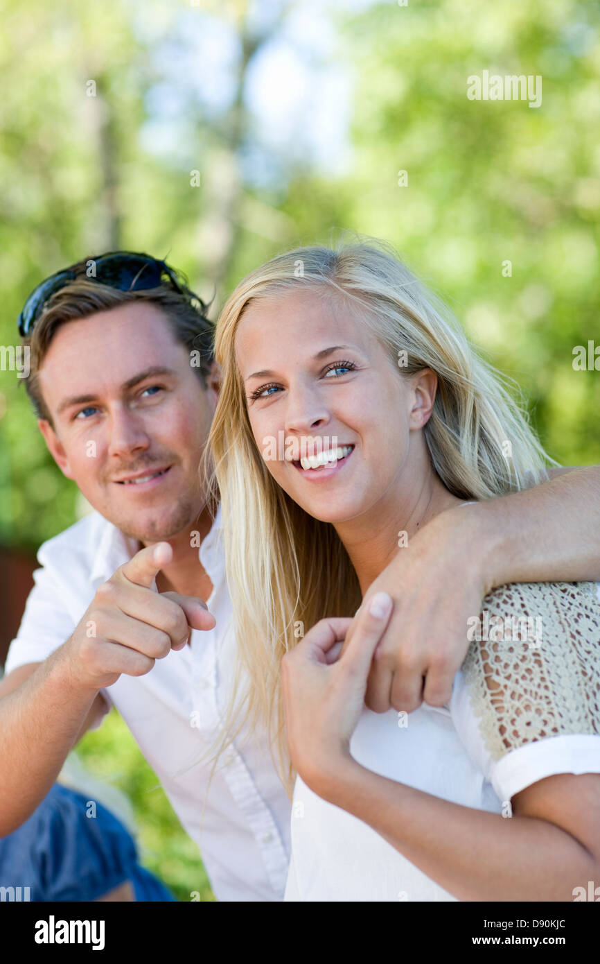 Women pointing at man hi-res stock photography and images - Alamy
