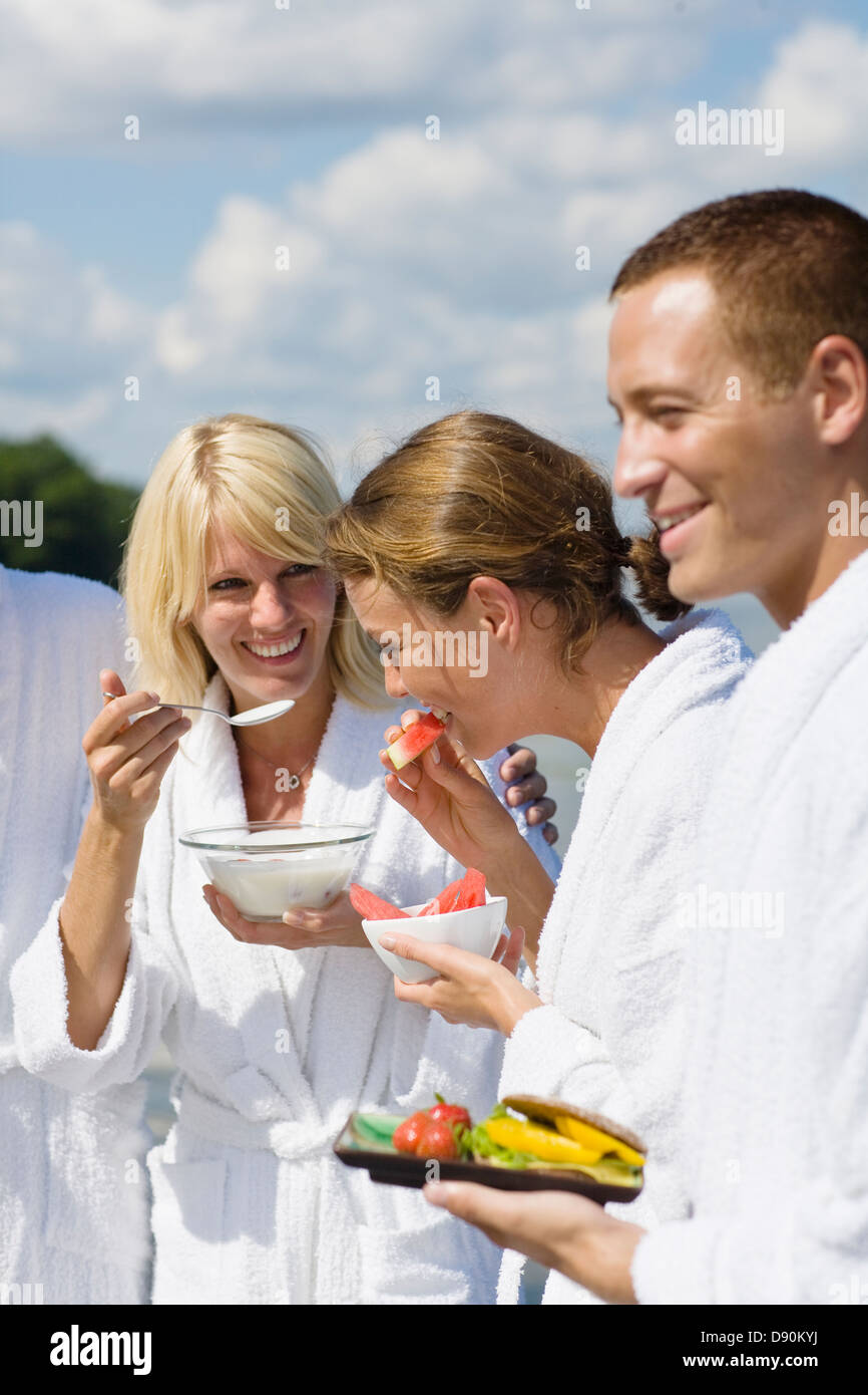 People in bathrobe enjoying breakfast Stock Photo - Alamy