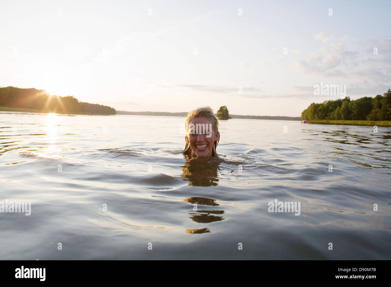 Woman Swimming In Lake Smiling Portrait Stock Photo Alamy