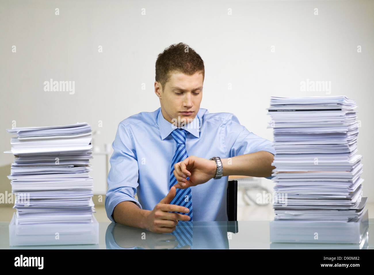 A man with a pile of paper Stock Photo - Alamy