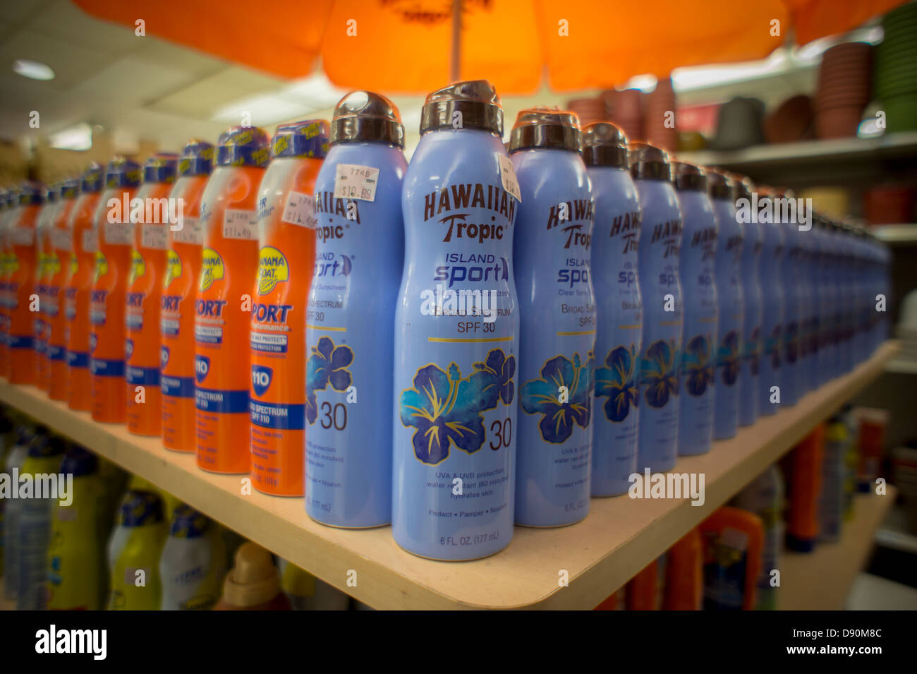 Bottles of Hawaiian Tropic and Banana Boat brand sunscreens are seen on