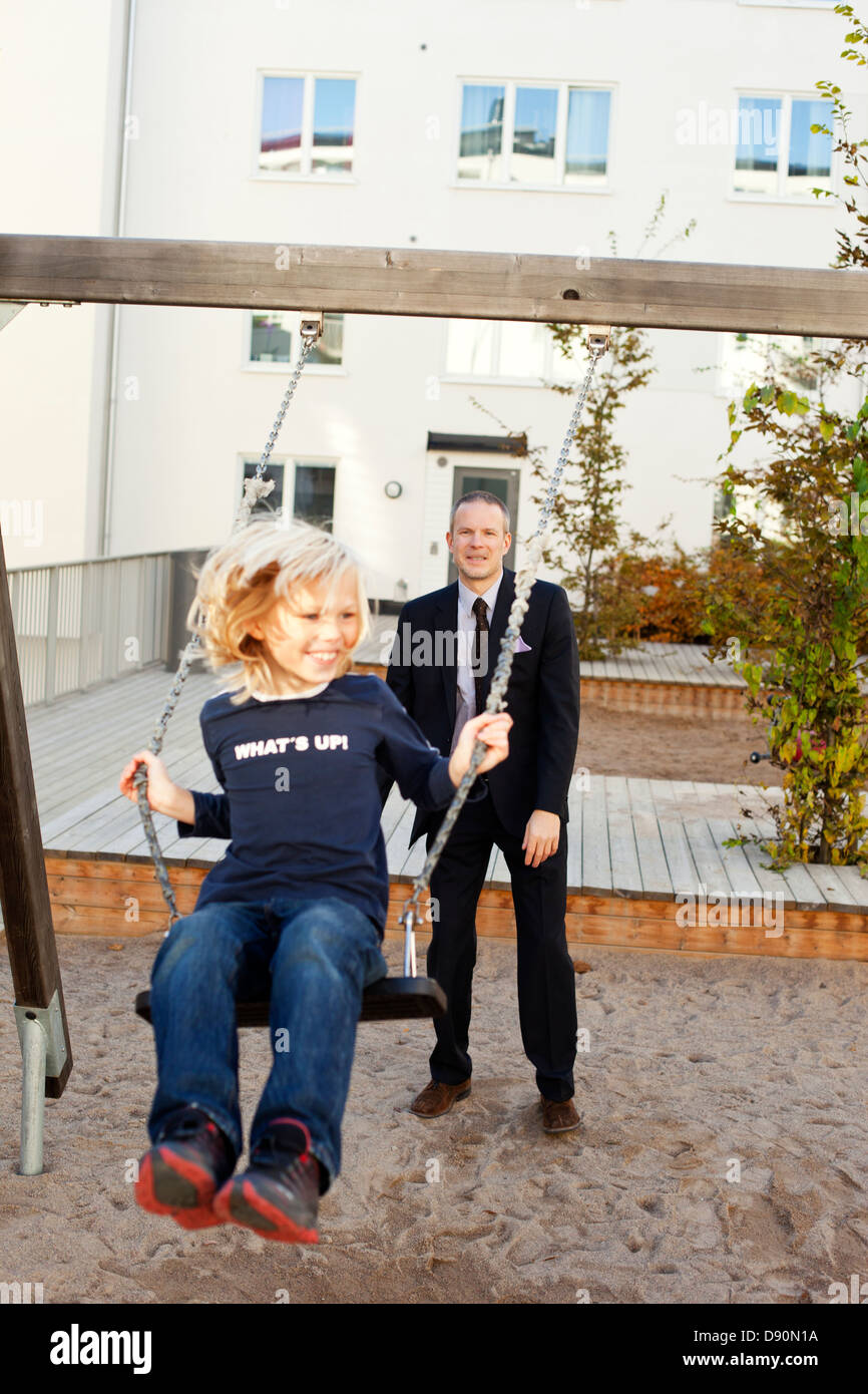 Father and son playing in playground Stock Photo - Alamy