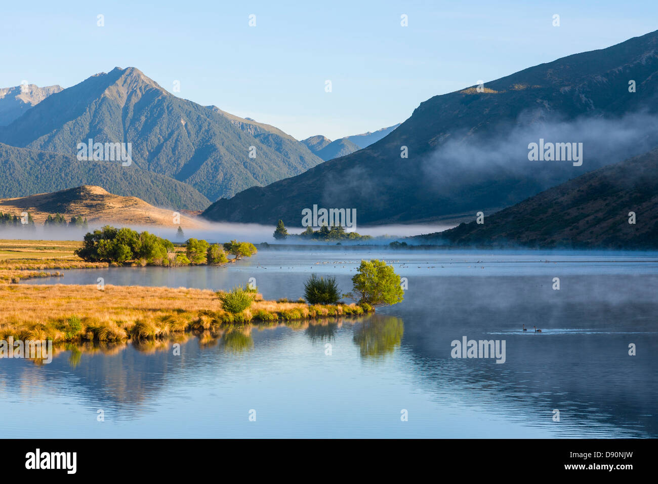 Lake Grasmere, Canterbury, New Zealand, in early morning light, with the Southern Alps as a backdrop. Stock Photo