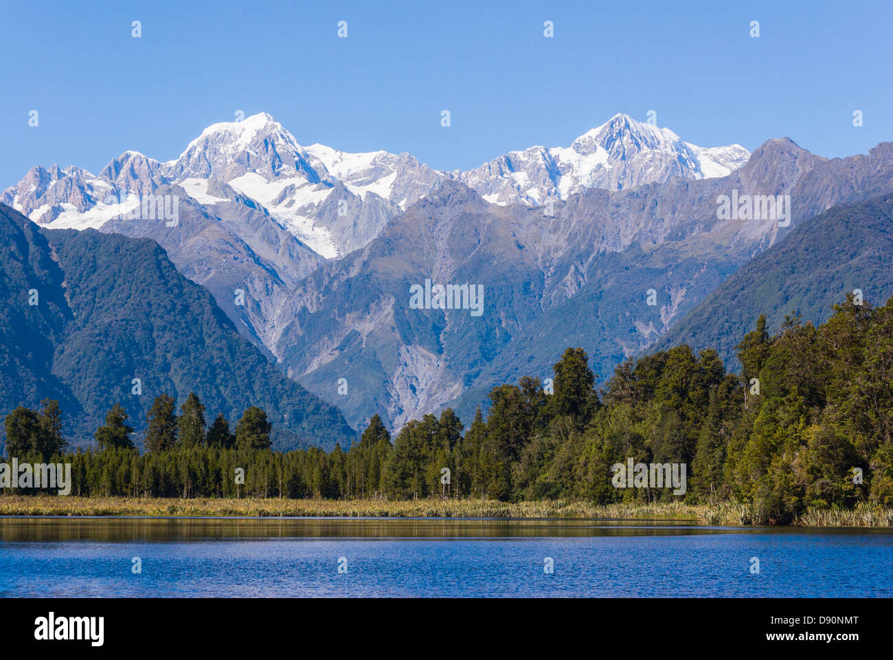 Aoraki Mount Cook (3754m) is the highest mountain in New Zealand and is seen here from Lake Matheson Stock Photo