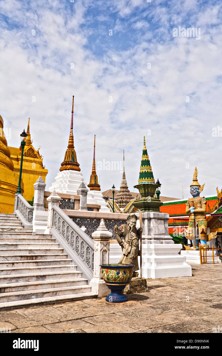 View inside the Wat Phra Kaew temple complex in Bangkok, Thailand, showing the variety of buildings and statues. Stock Photo