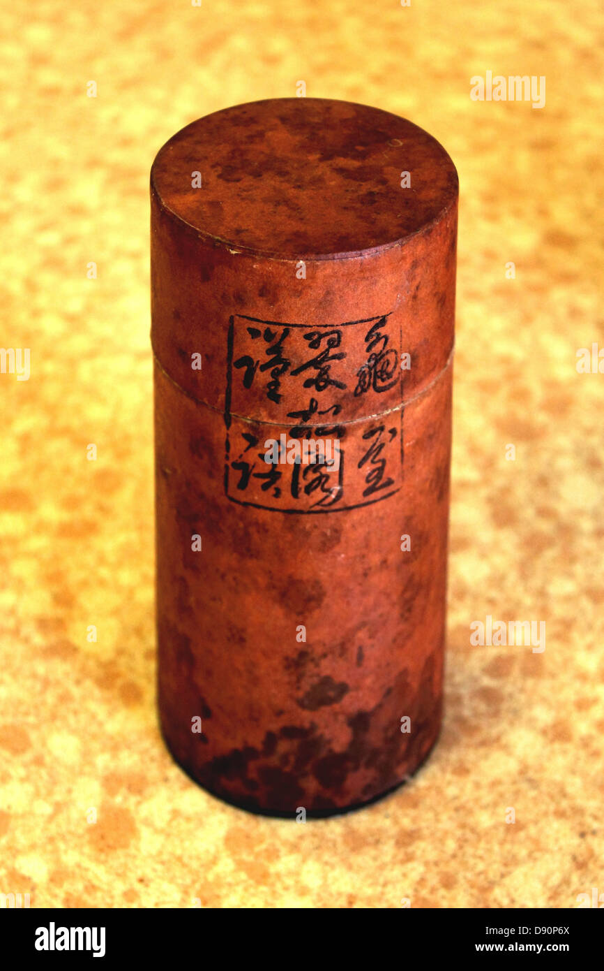 Small Japanese round cylinder herbal tea box. Stock Photo