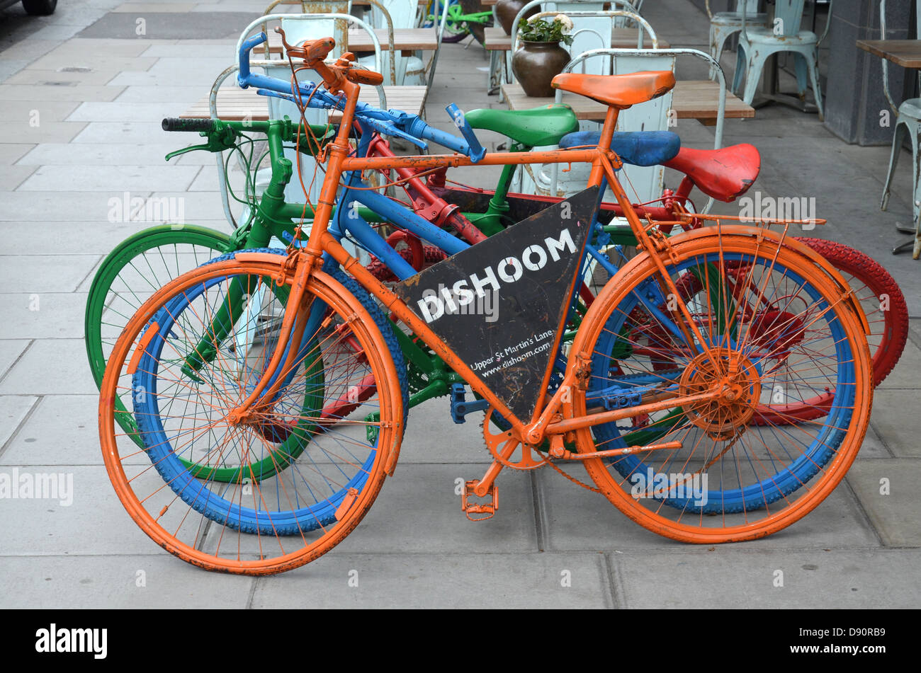 Colourful bicycles help to advertise Dishoom, a restaurant in Upper St Martin’s Lane in the Covent Garden area of London. Stock Photo