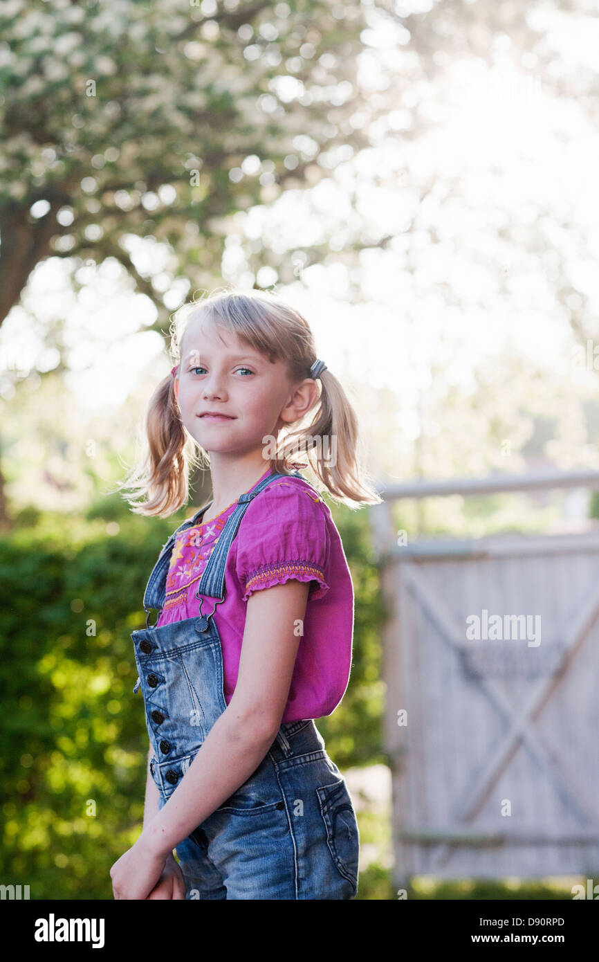 Portrait of smiling girl looking at camera Stock Photo - Alamy