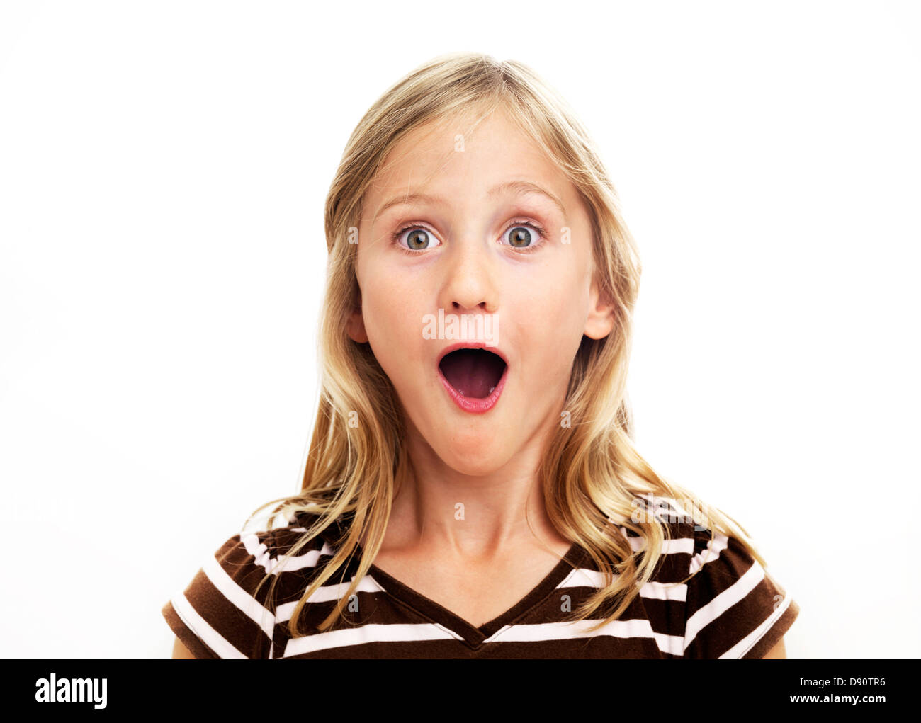 Portrait of smiling girl looking surprised, studio shot Stock Photo - Alamy