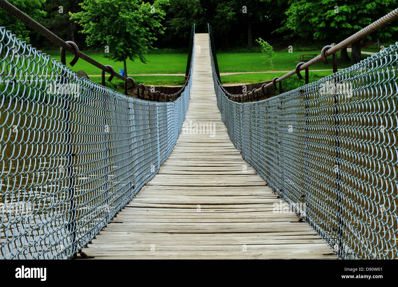 The longest swinging footbridge in the Midwest, beckons the adventurous hiker to give it a try. Stock Photo