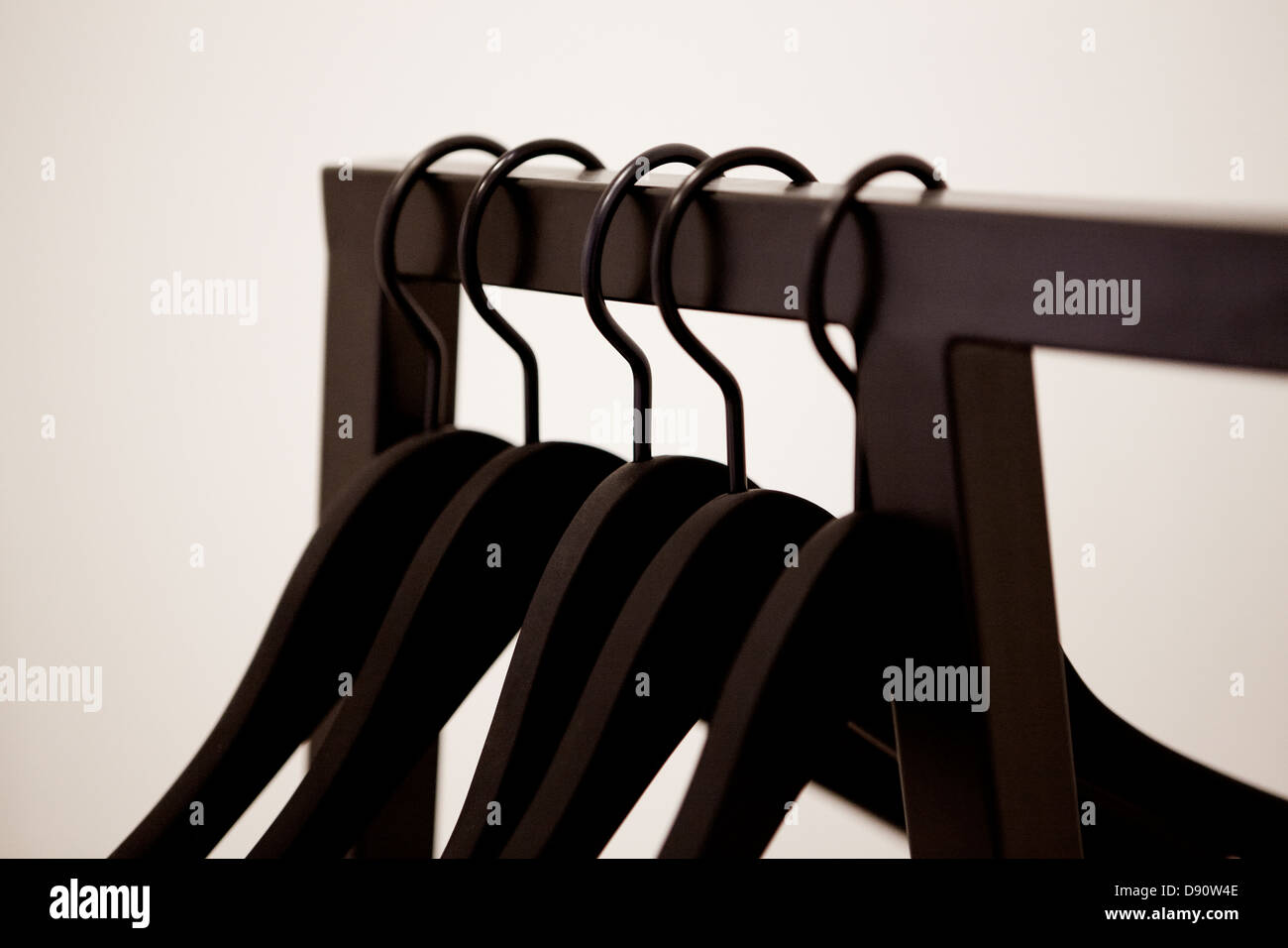 Coat hangers on clothes rack Stock Photo Alamy