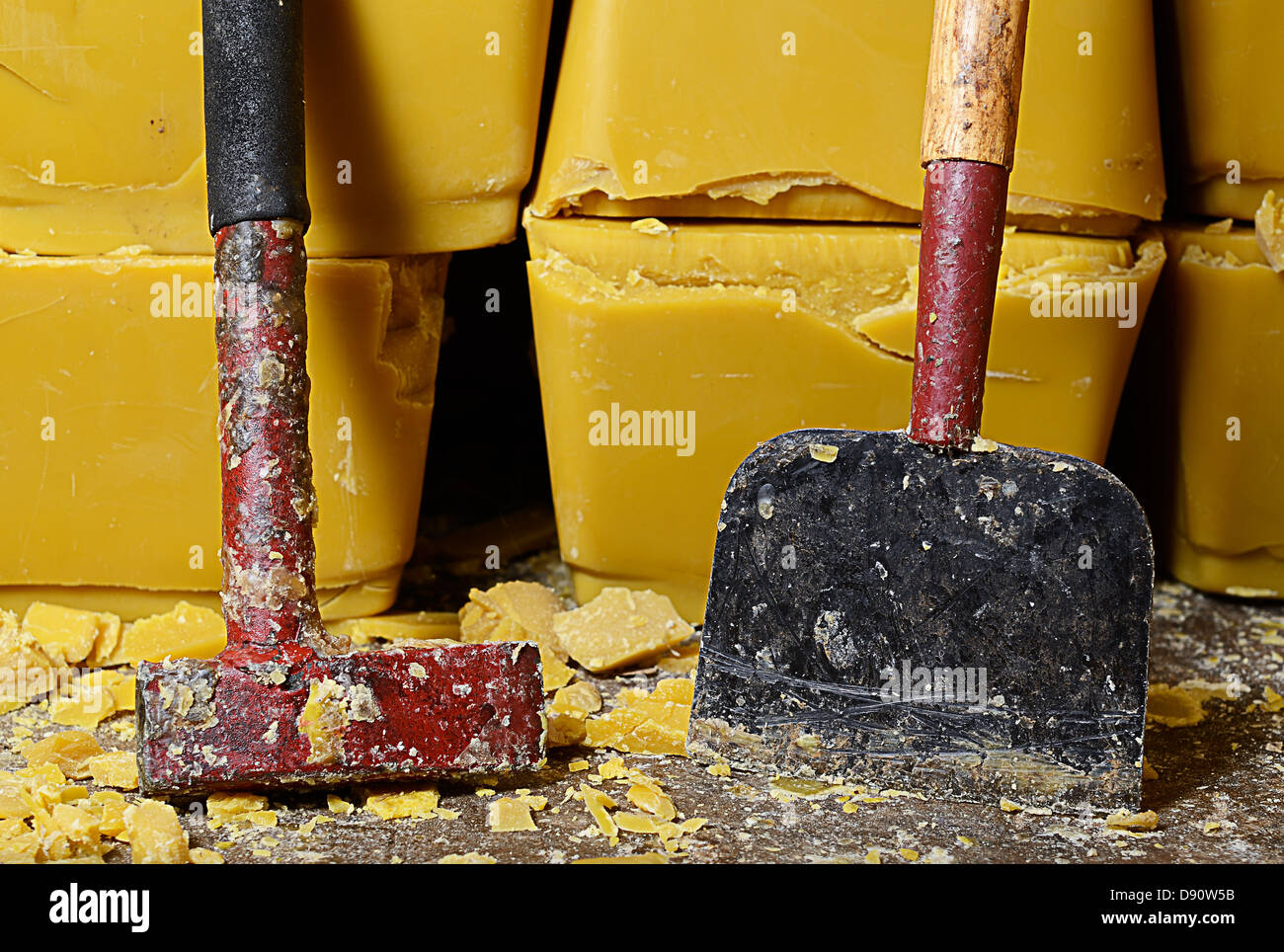 blocks of honey bee's wax and cutting tools Stock Photo