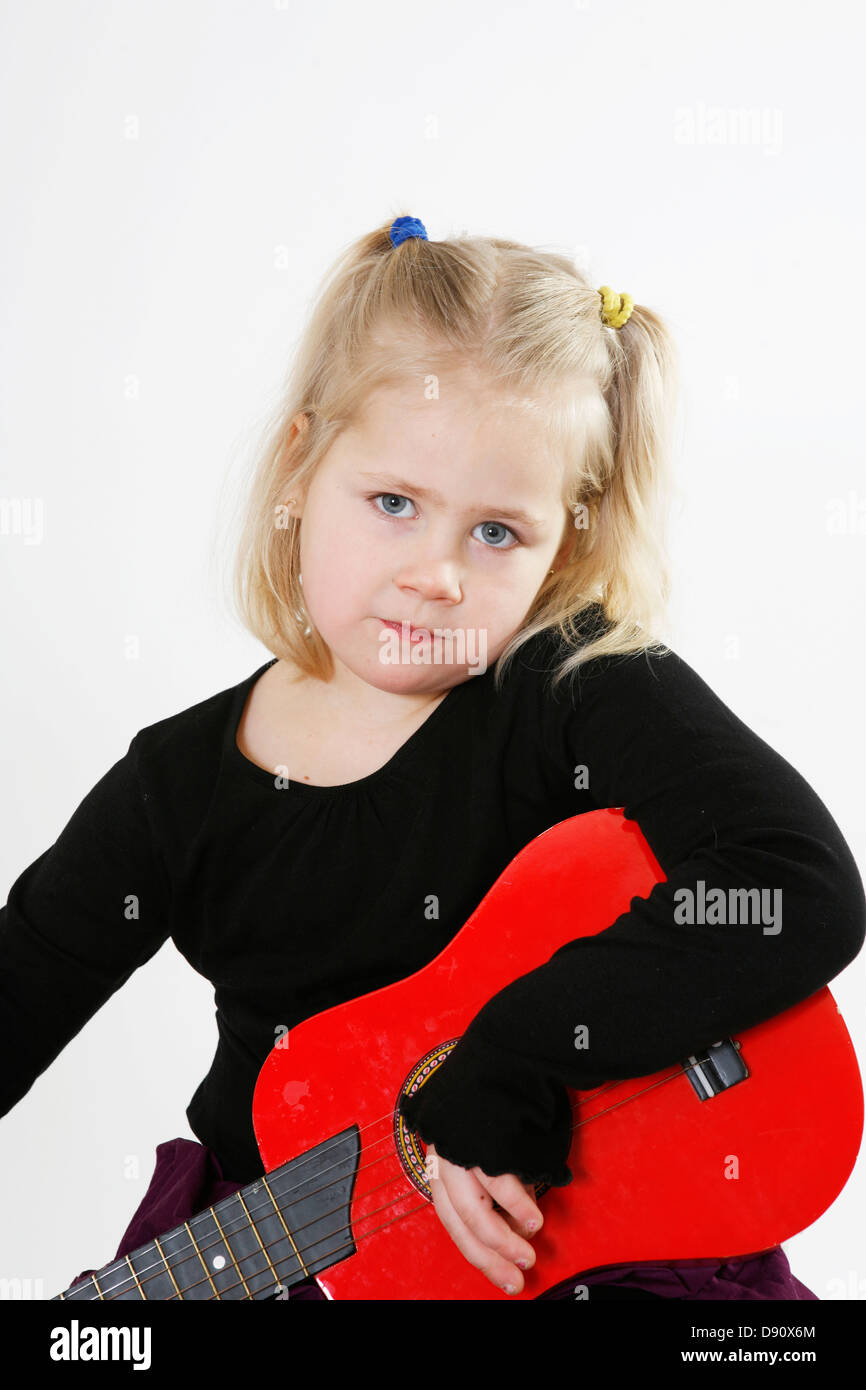 Portrait of girl holding guitar Stock Photo - Alamy