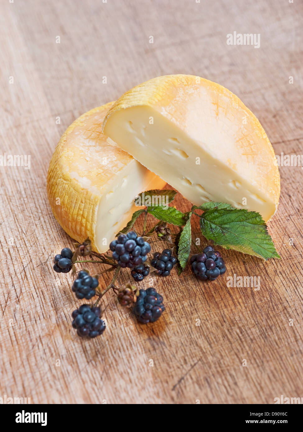 Chevre cheese and blackberries Stock Photo Alamy