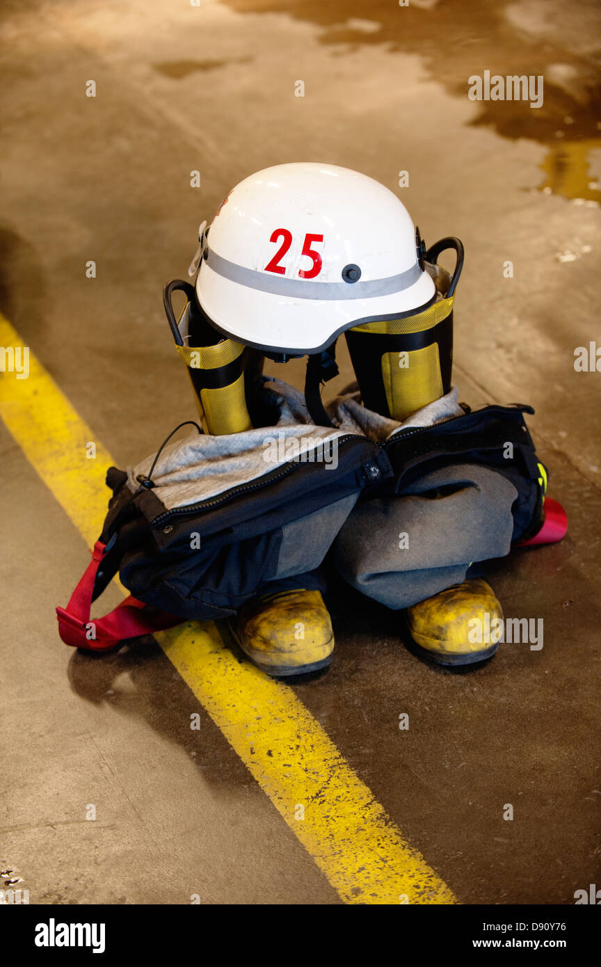 Boots, Coveralls And Helmet Of Firefighter Stock Photo - Alamy