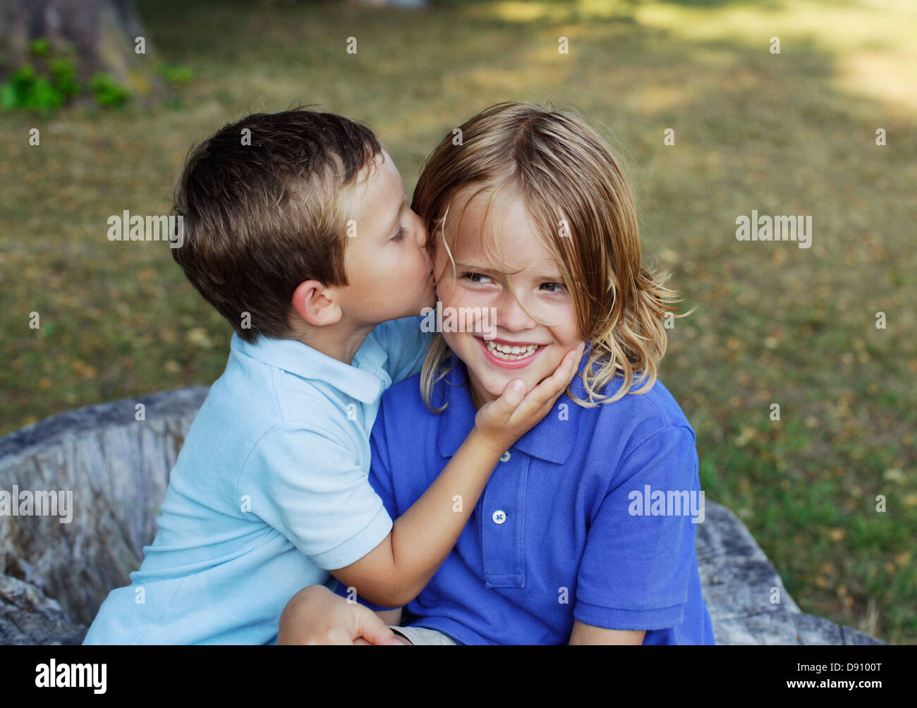 Boy kissing brother Stock Photo Alamy