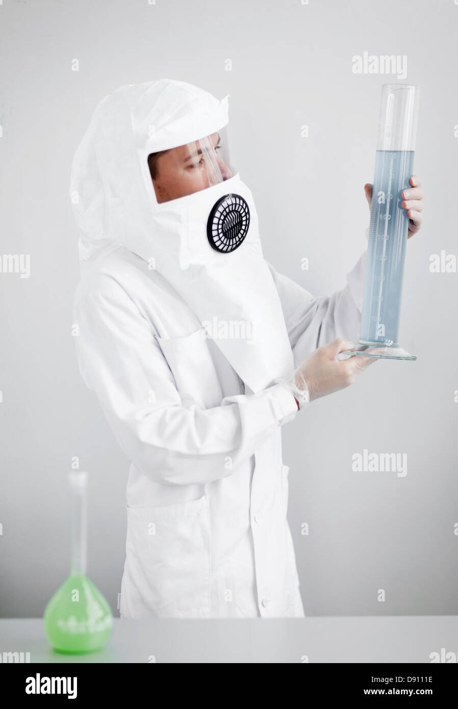 Male scientist in laboratory wearing protective suit Stock Photo - Alamy