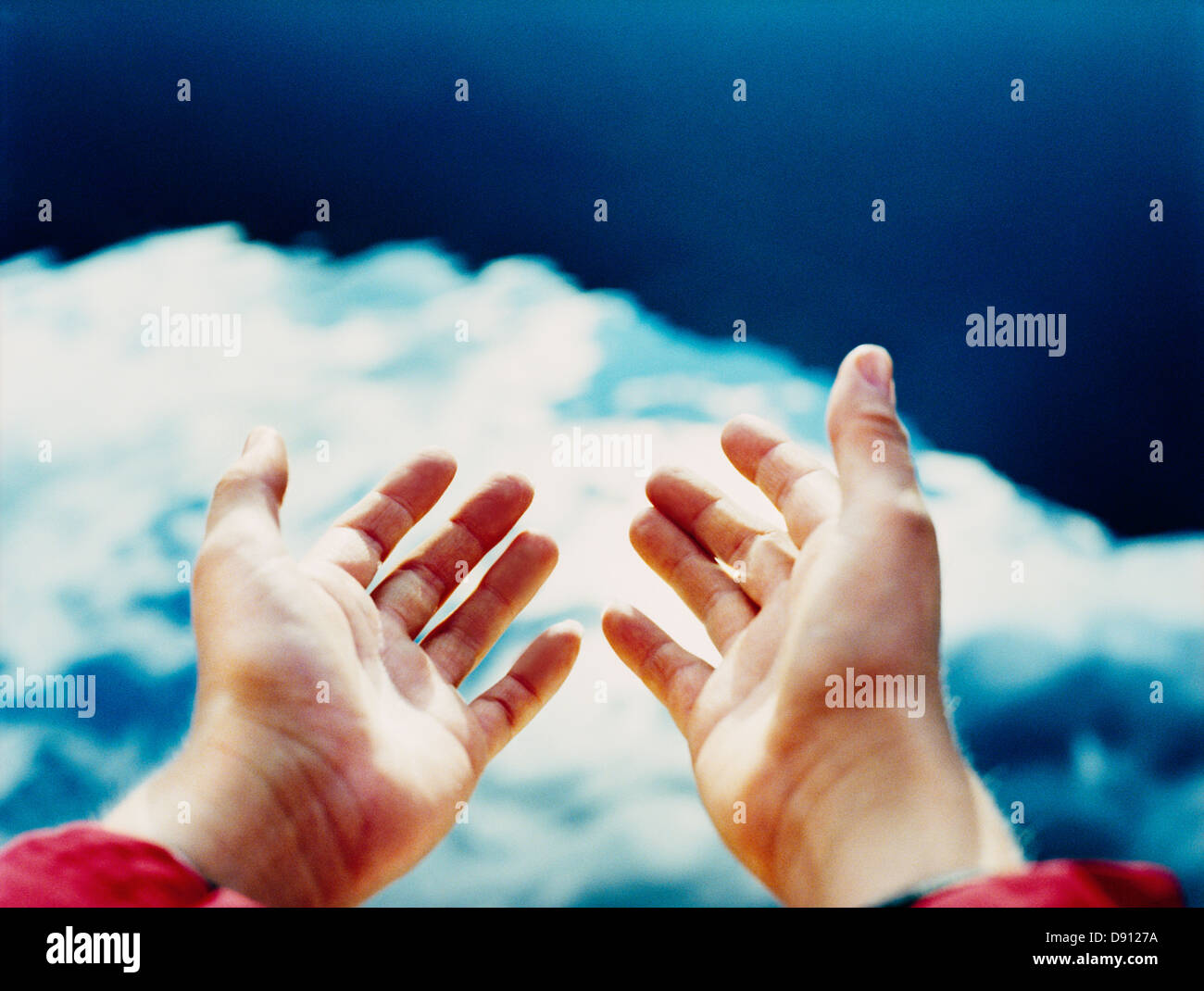 Hands reaching towards the sky Stock Photo Alamy