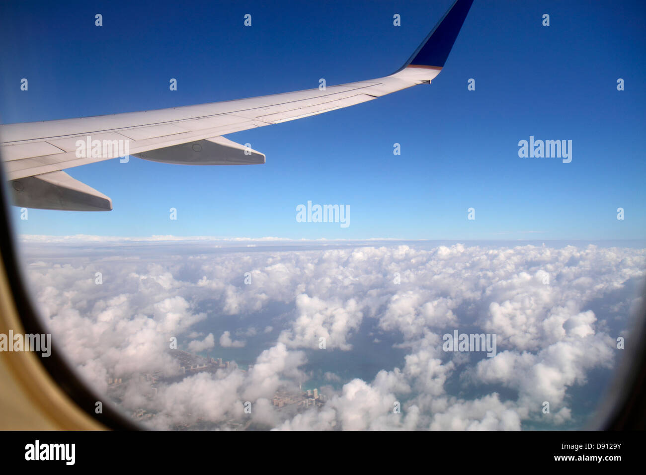 Miami Florida,International Airport,MIA,inflight,passenger cabin,United Airlines,passenger cabin,inflight,window seat,view,wing,clouds,blue sky,aerial Stock Photo