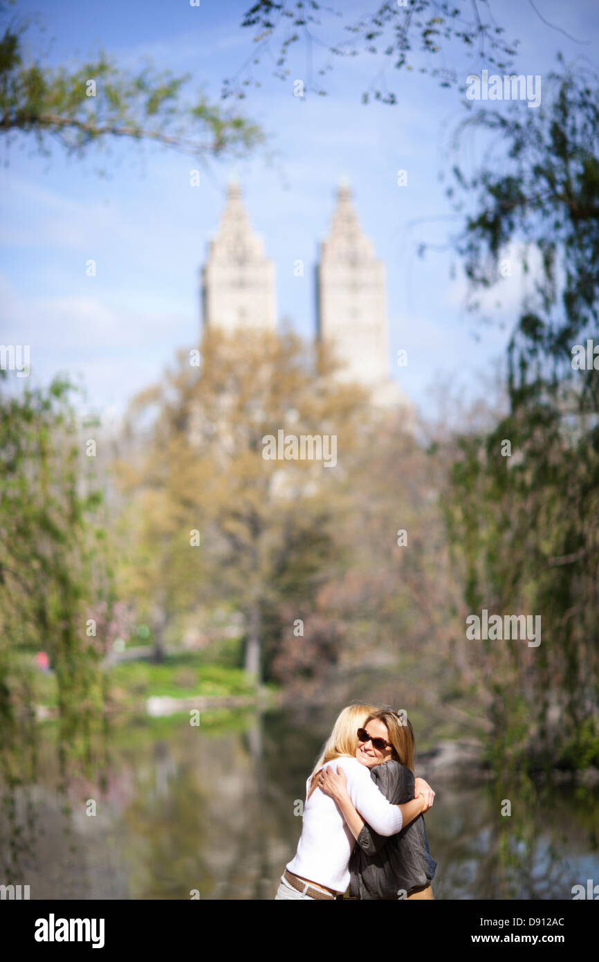 Mother and daughter hugging in Central Park Stock Photo