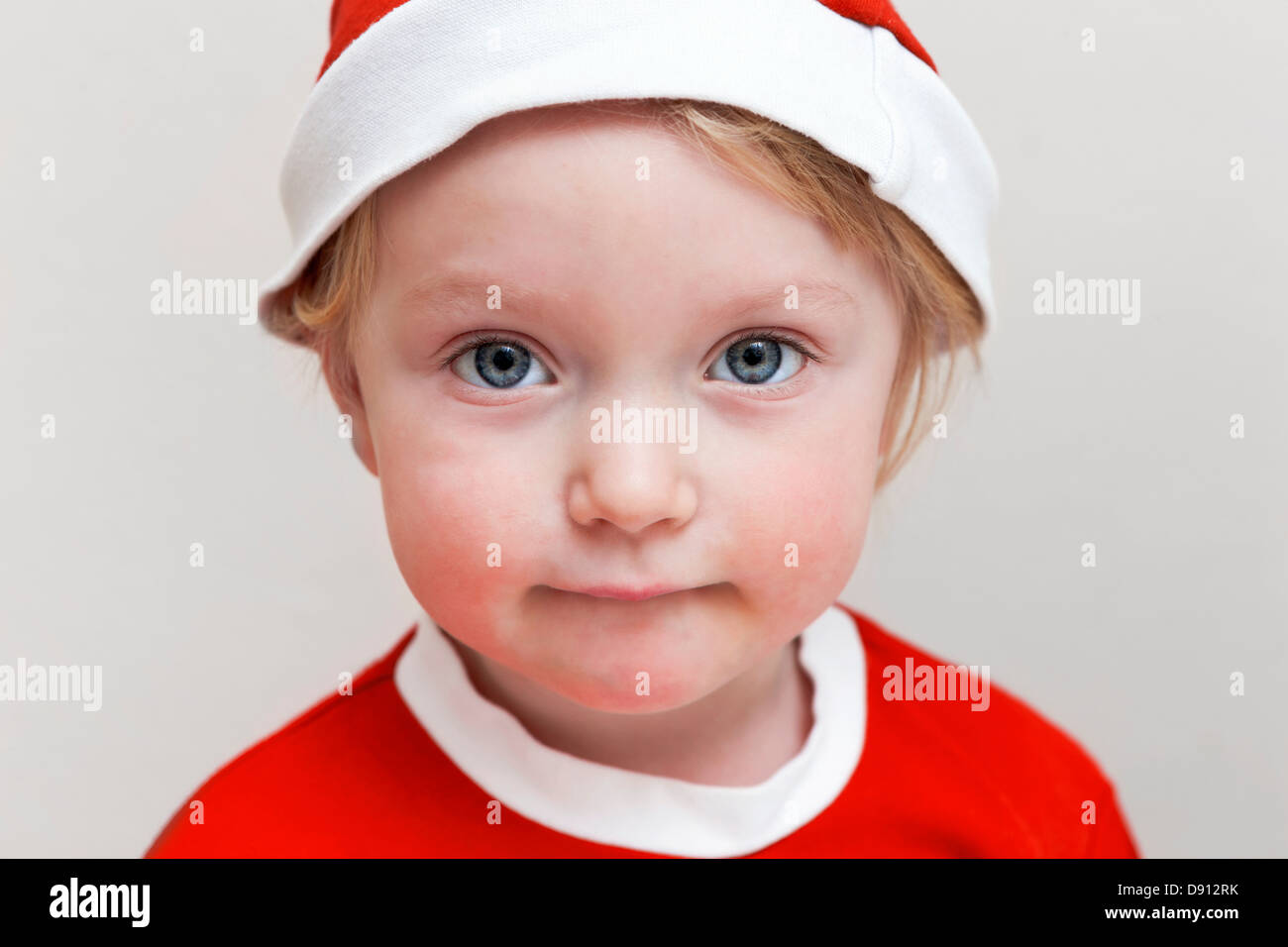 Portrait of girl wearing Santa hat Stock Photo Alamy