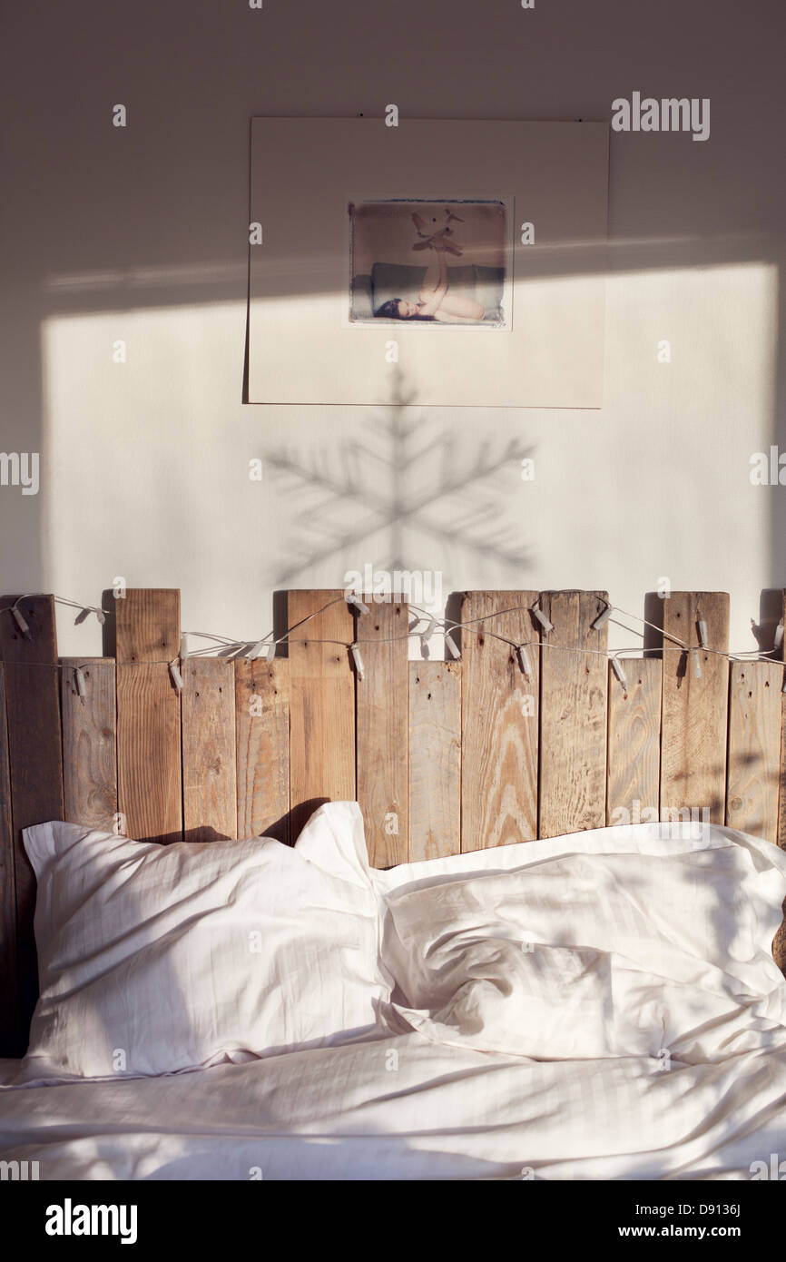 Double bed with wooden headboard Stock Photo Alamy