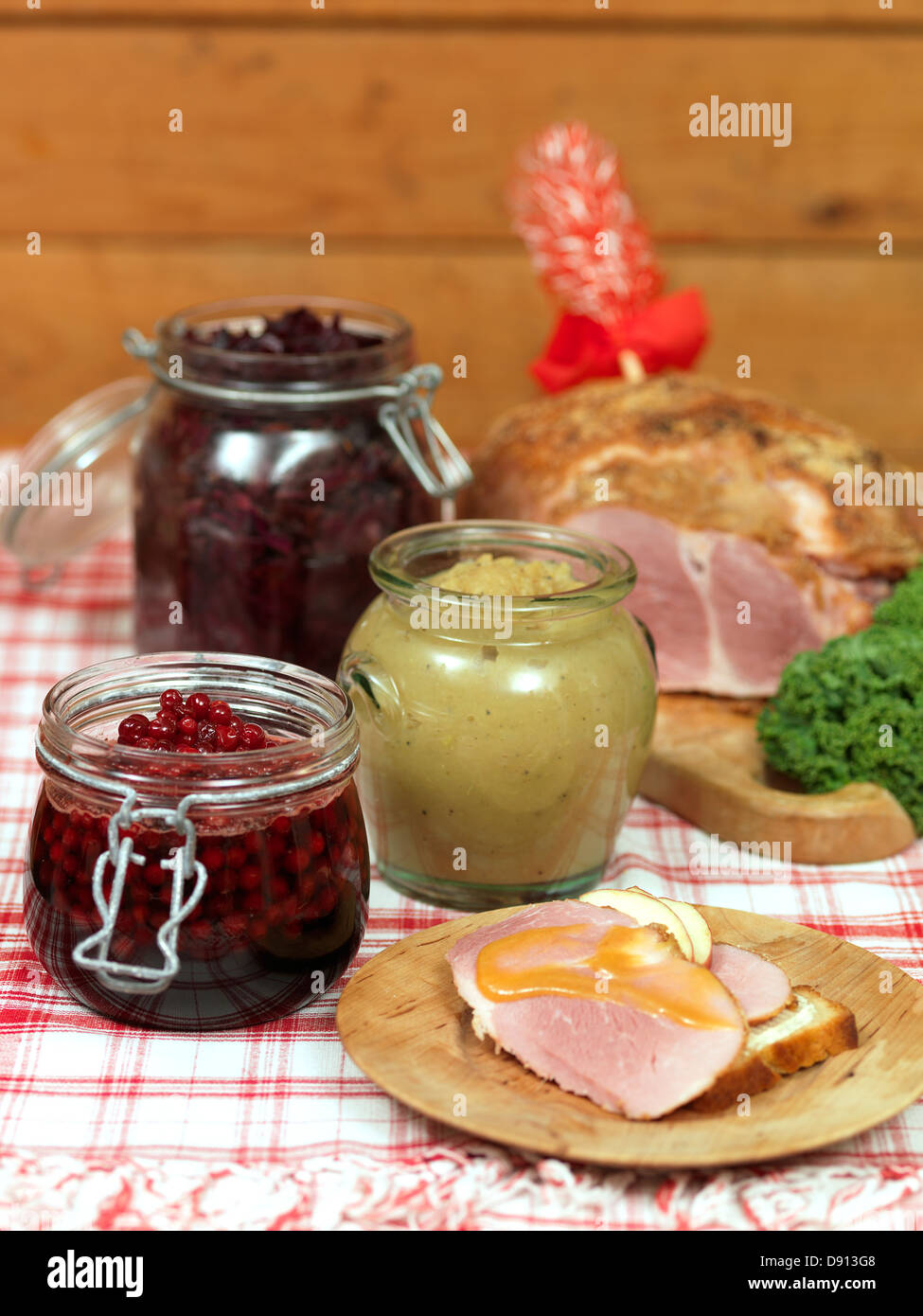 Christmas ham and preservatives on table Stock Photo