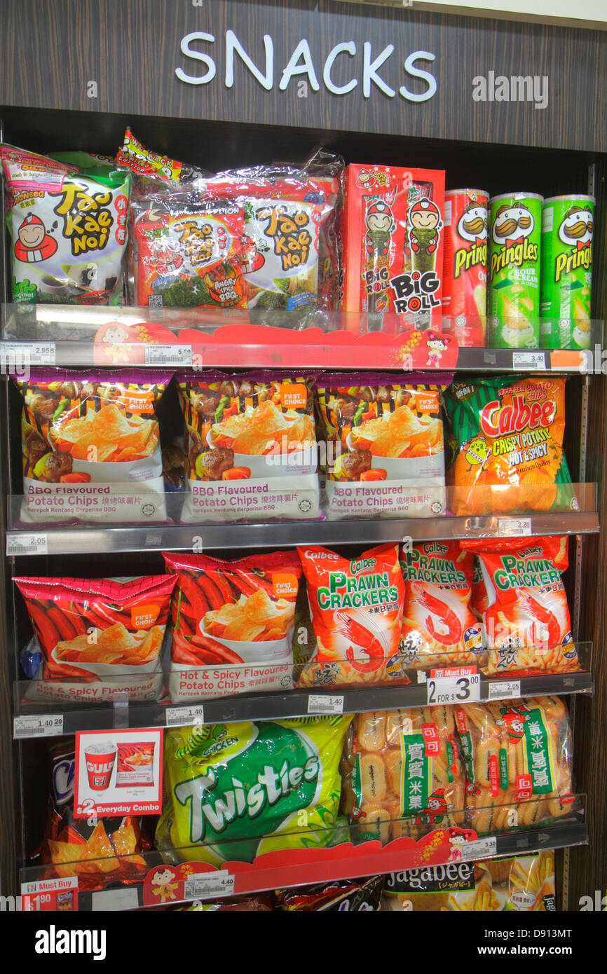 Singapore Kallang Road,7-Eleven,convenience store,snacks,snack food,junk food,display sale crackers,chips interior,Sing130201028 Stock Photo