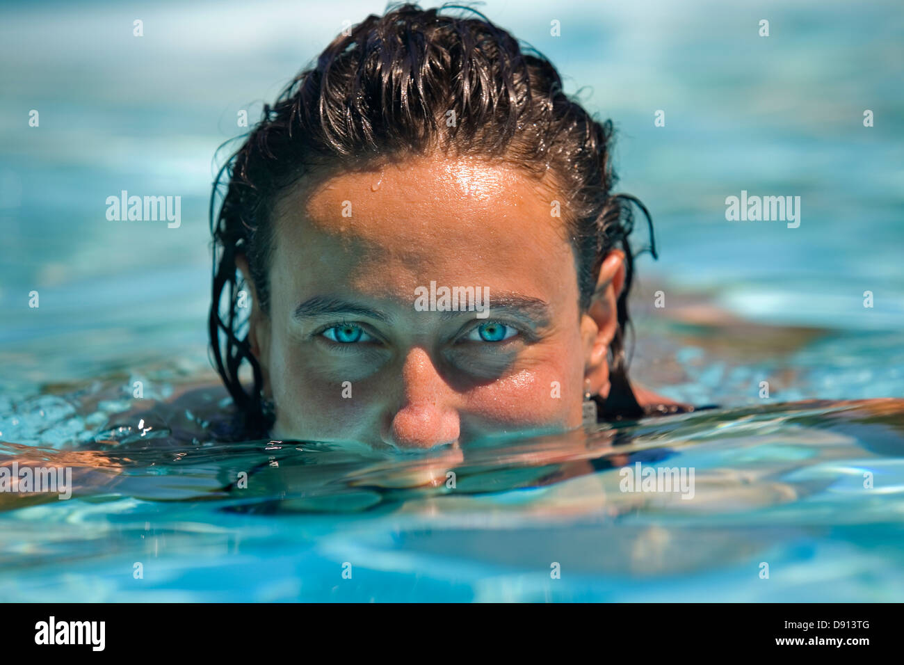 Young woman portrait in a swimming pool Stock Photo - Alamy