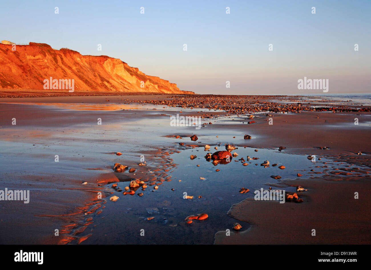 A view of the beach and cliffs at first light at East Runton, Norfolk, England, United Kingdom A view of the beach and cliffs at first light at East Runton, Norfolk, England, United Kingdom