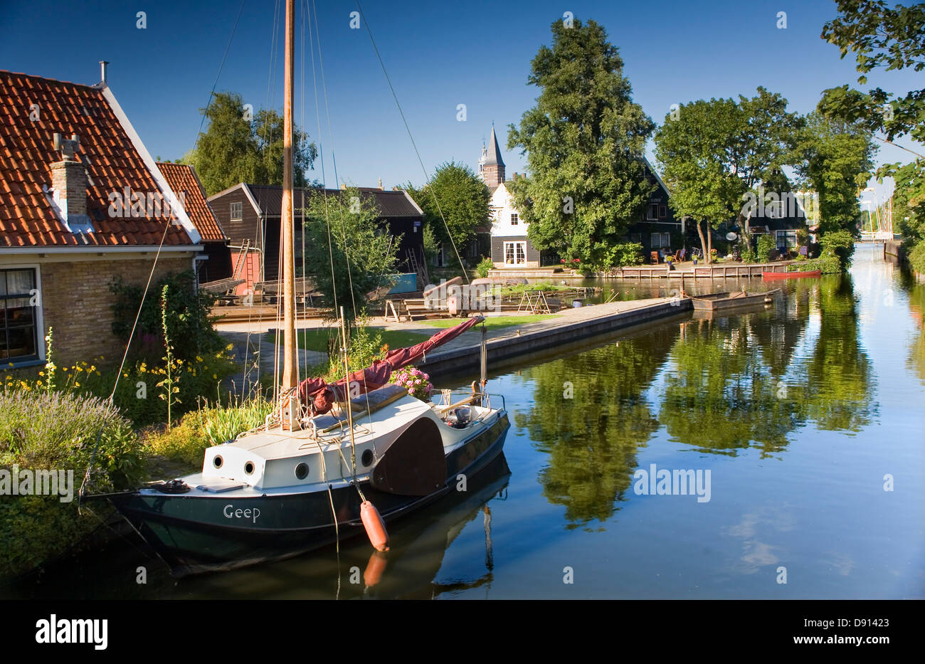 Canal with sailboat in Edam, Holland, Netherlands, Europe Stock Photo