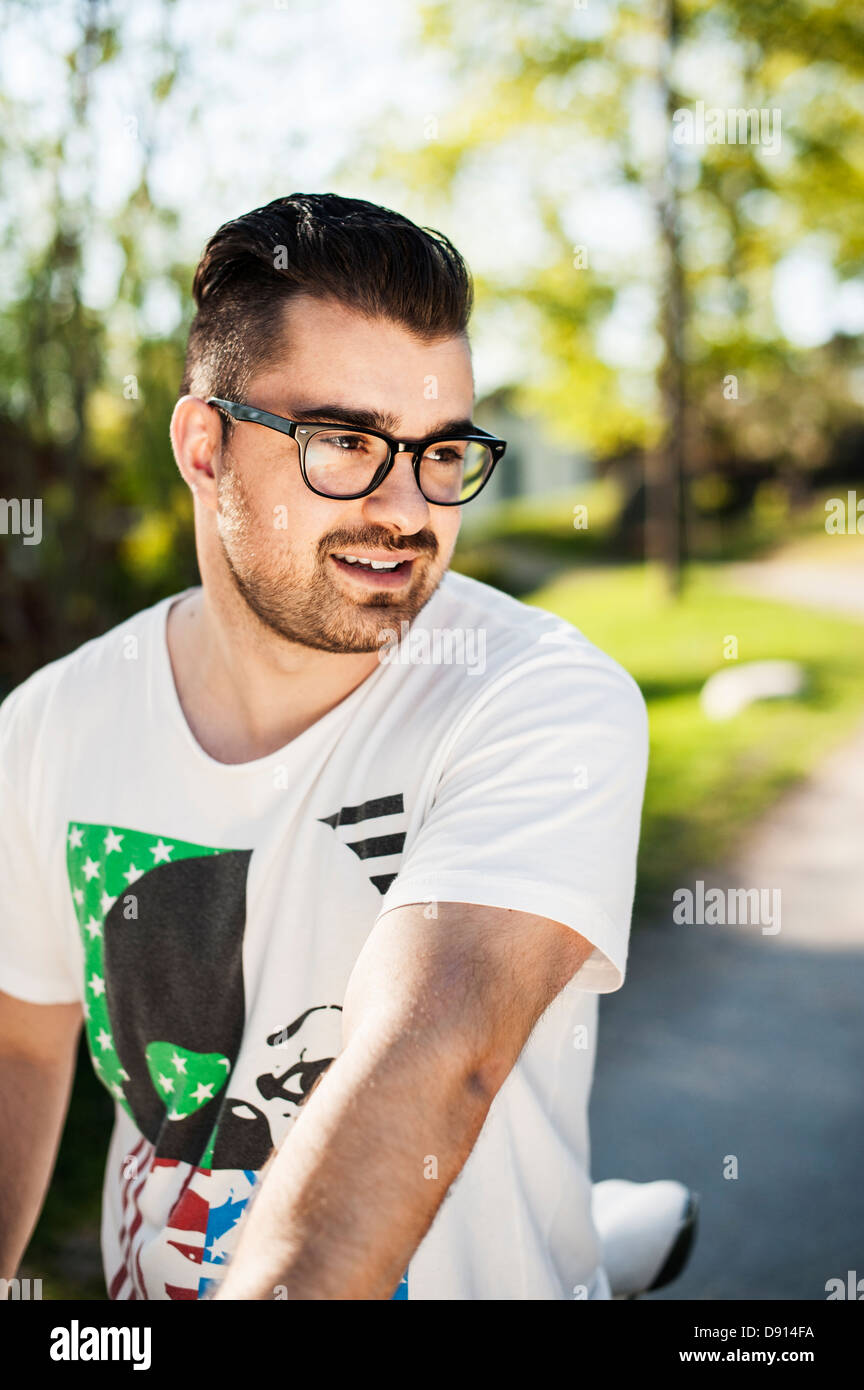 Happy young man glasses wearing hi-res stock photography and images - Alamy