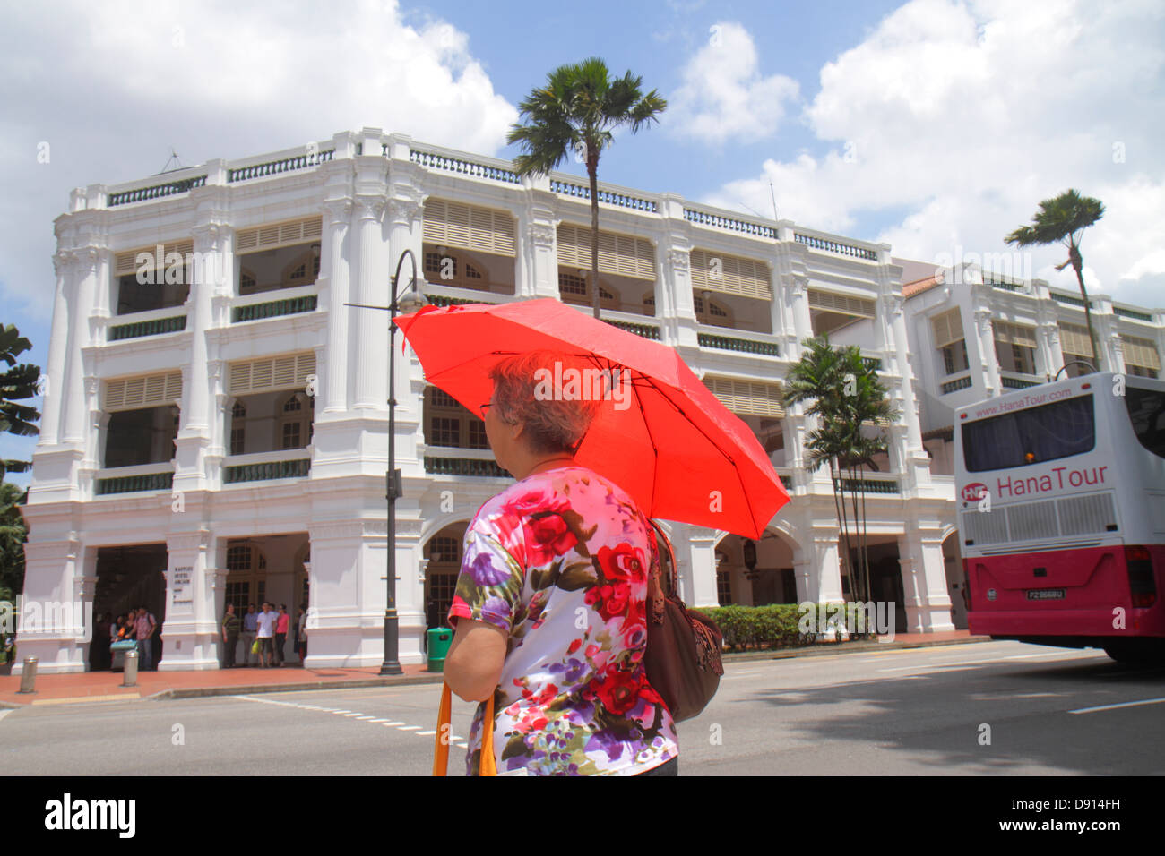 Singapore,Bras Basah Road,Raffles Boulevard,Asian Asians ethnic immigrant immigrants minority,adult adults woman women female lady,red,umbrella,shade, Stock Photo