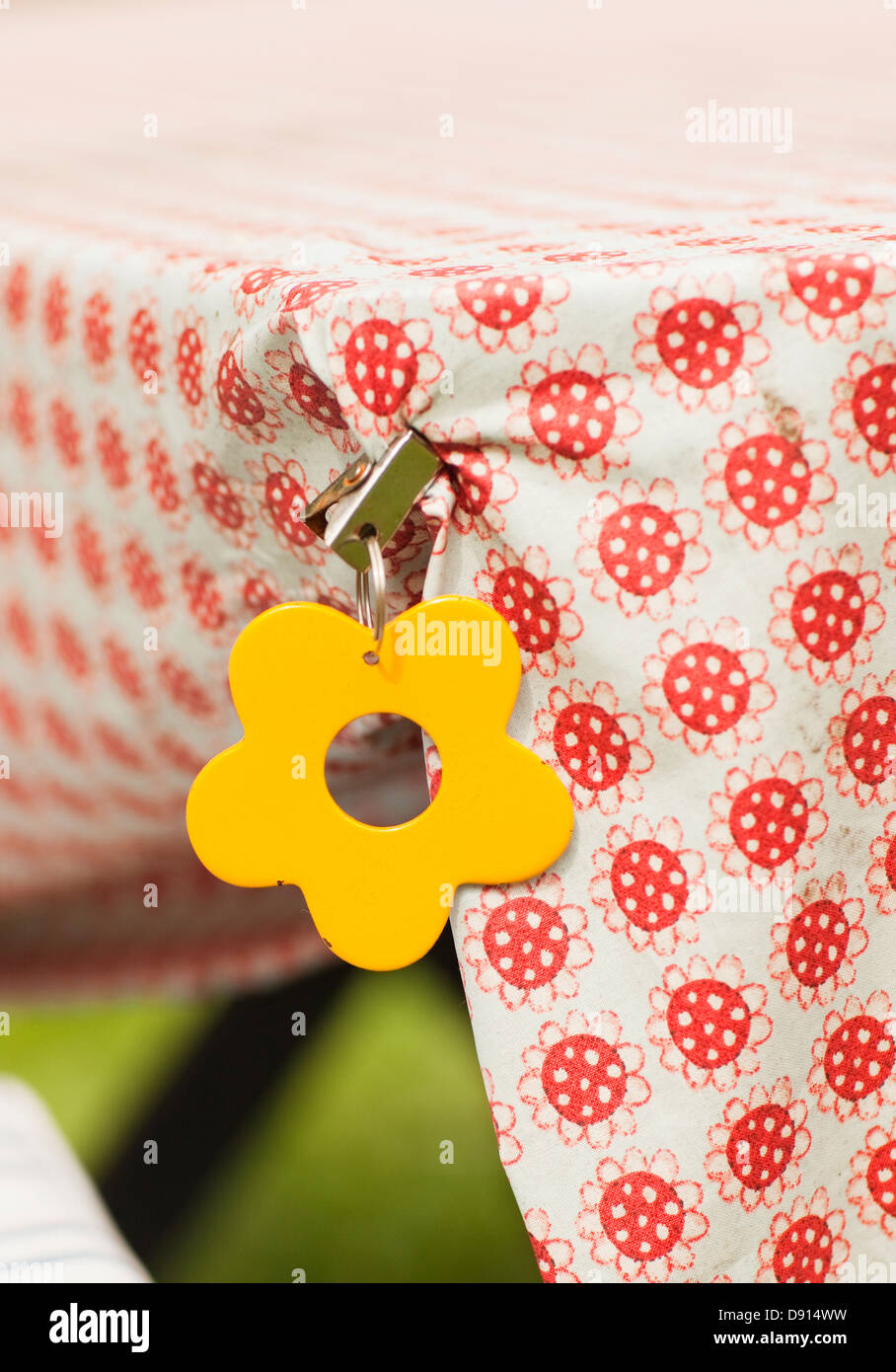 Table cloth with flower shaped clip Stock Photo