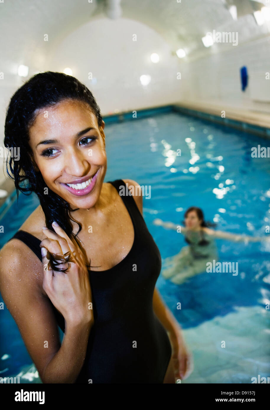 Two young women at public swimming baths, Stockholm, Sweden Stock Photo
