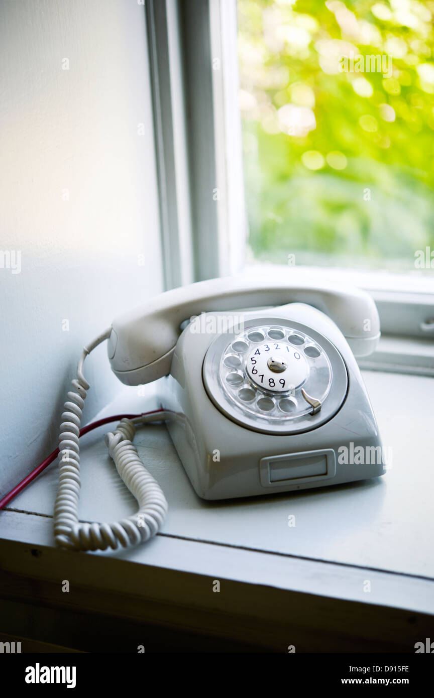 Landline phone on window sill Stock Photo