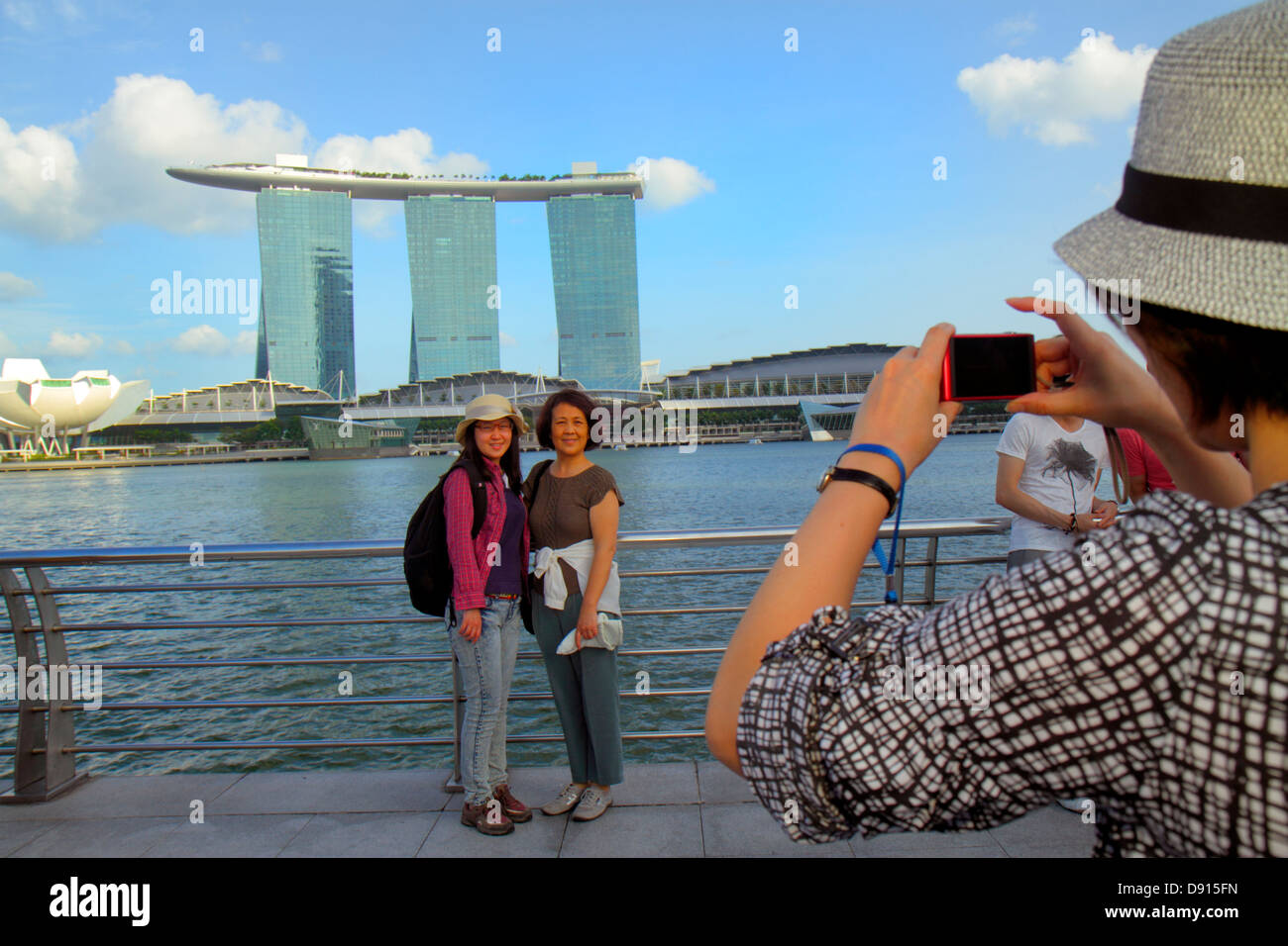 Singapore,Singapore River water,Marina Bay water,Merlion Park,Asian Asians ethnic immigrant immigrants minority,adult adults woman women female lady,p Stock Photo