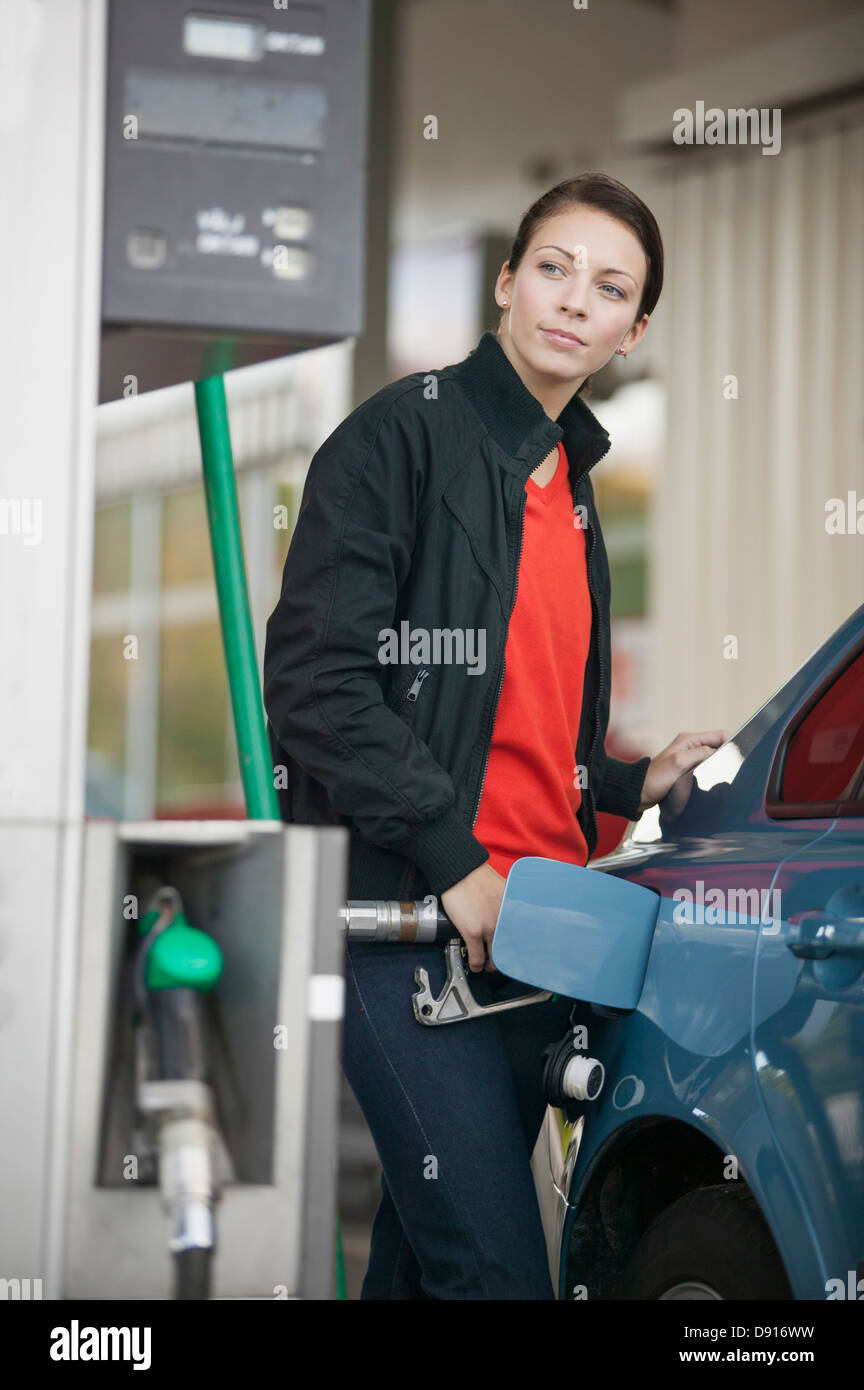 Woman filling car with petrol Stock Photo